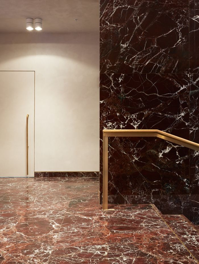 “RJH always has artwork in the lobby of its buildings, and music playing.” The stone is rosso levante marble.