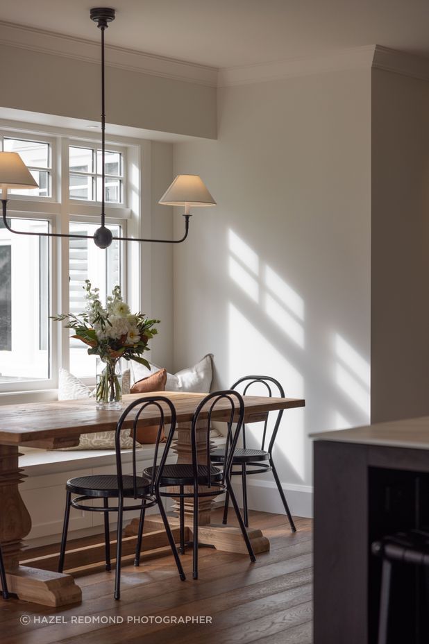 A built in bench seat adds a farmhouse flair to the dining area.
