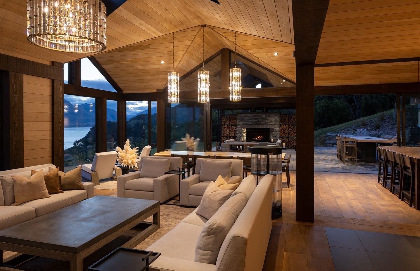 Directly mirroring the interior living spaces, is a sheltered outdoor living space, complete with fireplace, lounge area and outdoor kitchen.