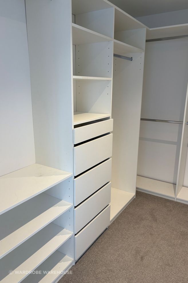 The original wardrobe lacked adequate drawer space, with too many hanging sections and open shelves.