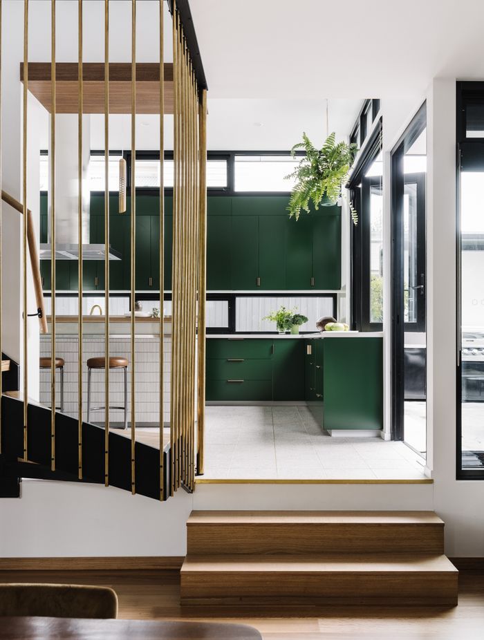 Stepping up from the living and dining, the kitchen floor features beautiful Promenado terrazzo tiles from Beaumont Tiles.