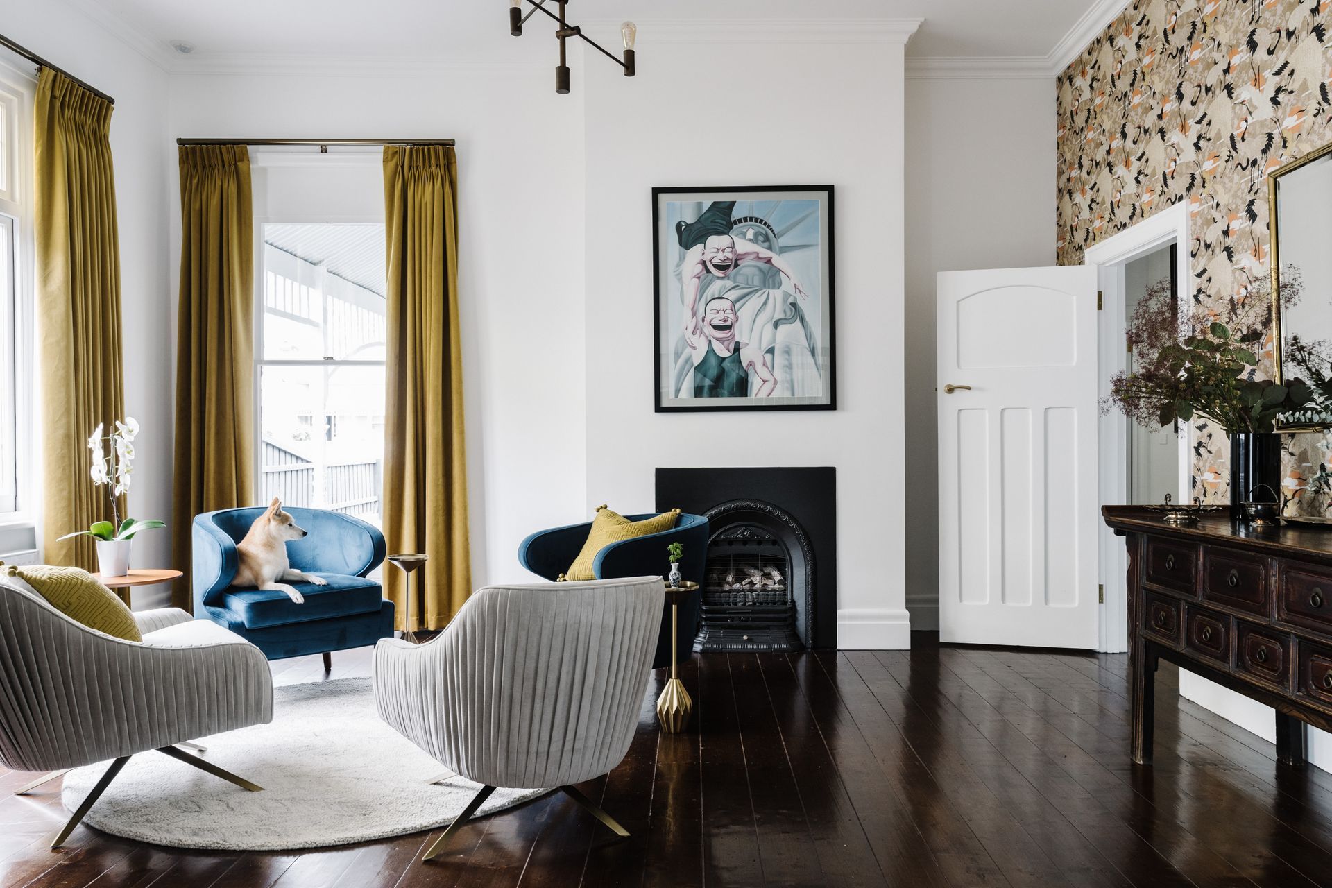 The blue velvet armchairs were made in Shanghai, with the mustard curtains made locally in Ballarat.