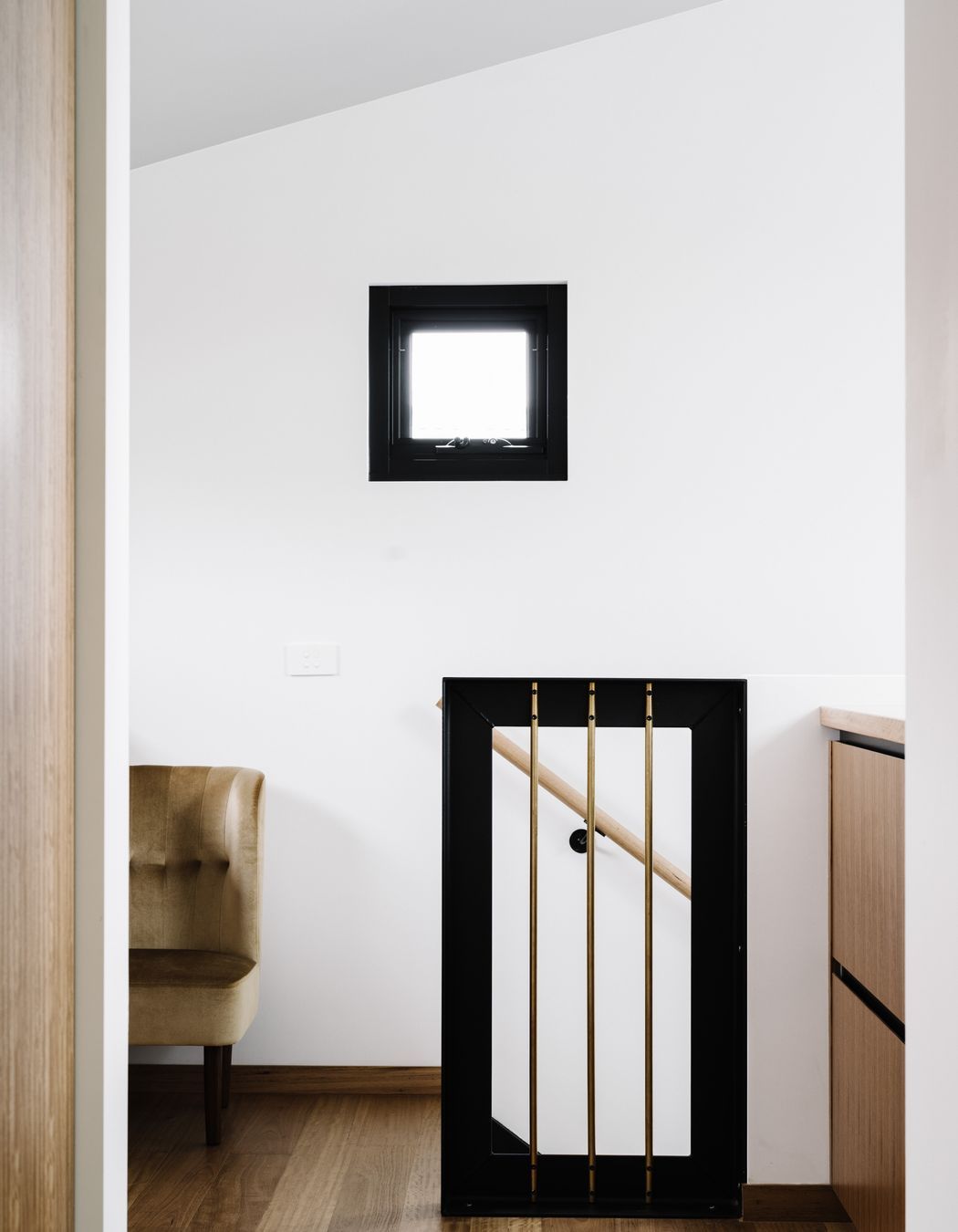 Just outside the bedroom are large blackbutt drawers and benches for packing bags before heading to the airport.