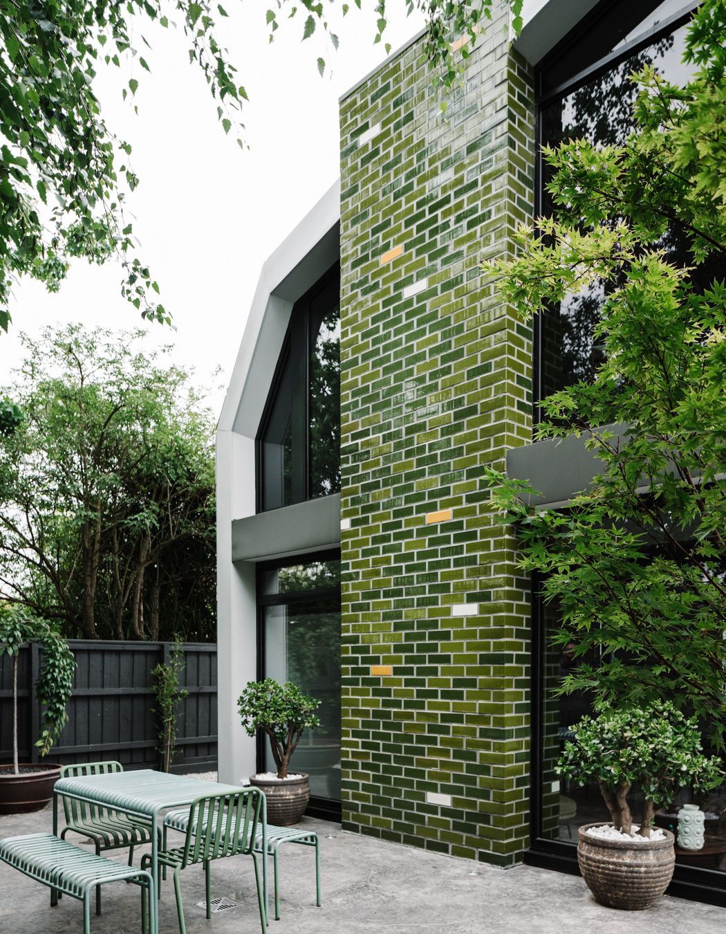 The glazed handmade brick tiles channel the Australian bush.