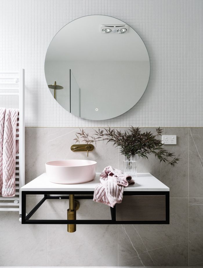 The guest bathroom is in the original part of the home. “It’s quite classic with light colours, a rose sink and brass fittings and fixtures. It’s really come out well and we’re very proud of it.”