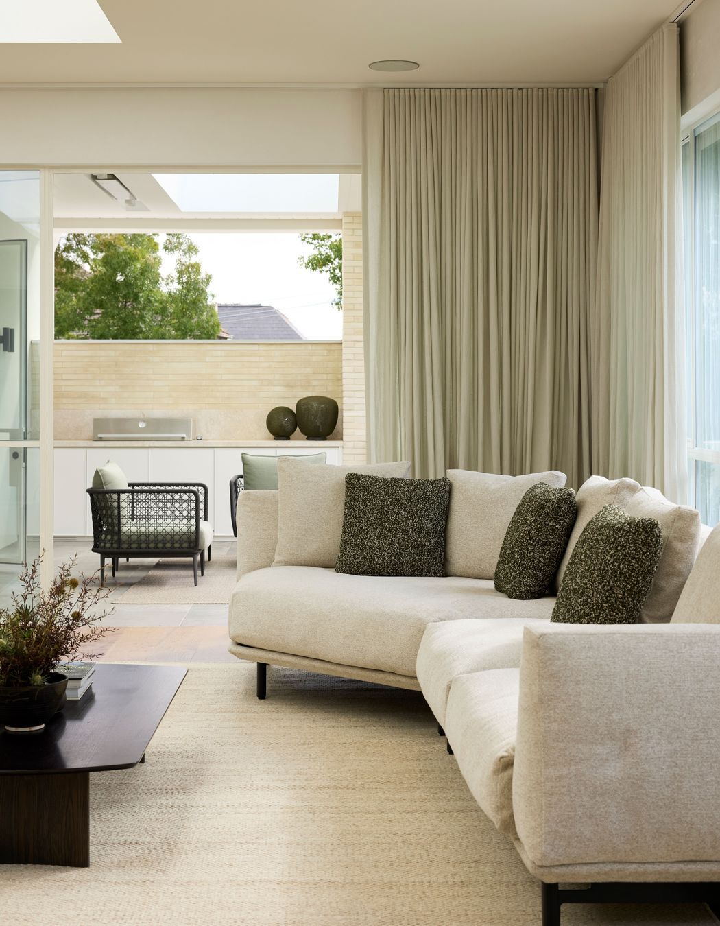 Outdoors, the Aireys woven lounge chairs are featured.