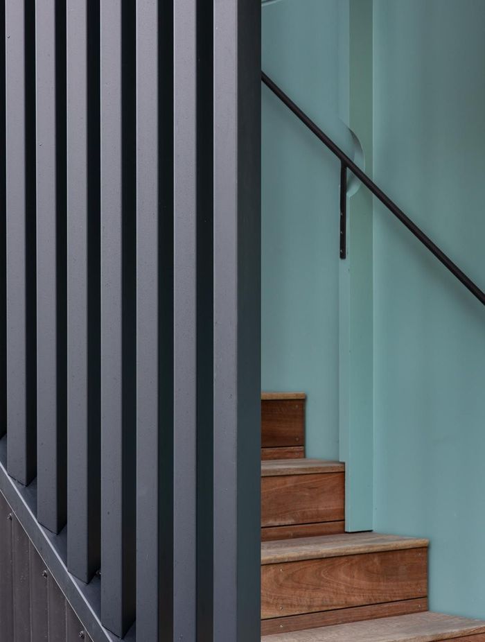 “We used the battens on the stairwell wall to run the handrail through small circular cutouts. The idea just popped out of my head at one point. It can be tricky to know how to do your brackets for the handrails.”