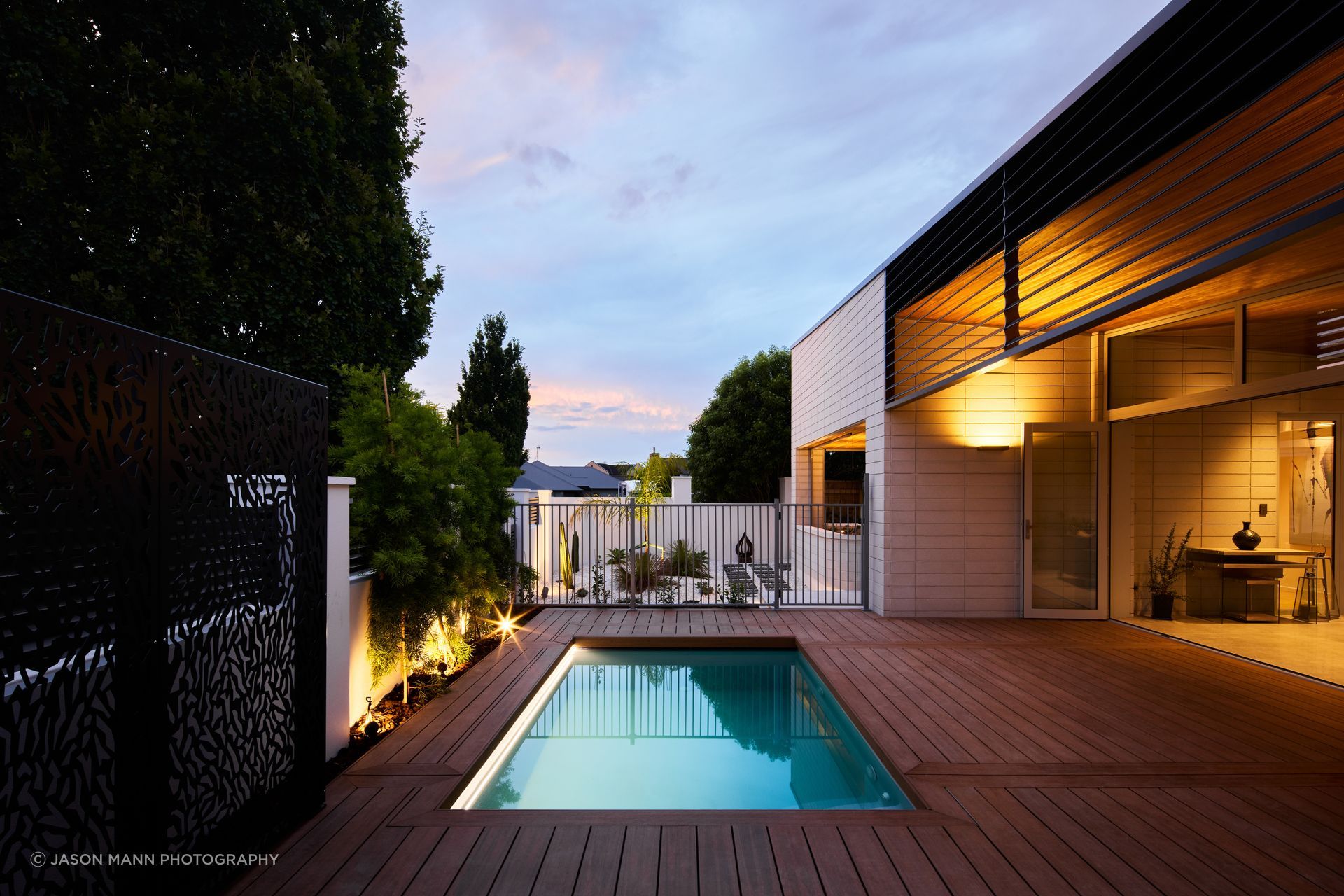 The brick creates a strong, protected feel, says Nick, punctuated with warmer Abodo timber. Louvres control the amount of evening sun in the outdoor room.