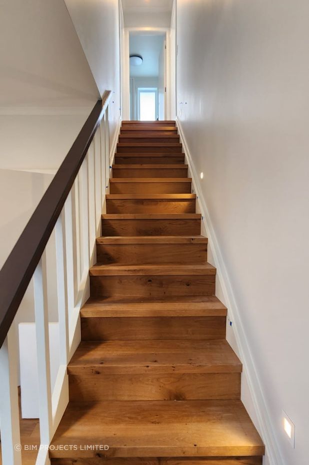 The engineered oak staircase is a standout feature of the home.