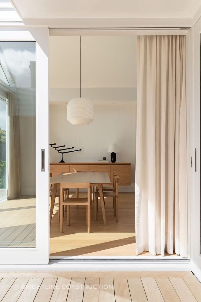 The soft palette of timber and white creates a gentle, relaxing atmosphere.
