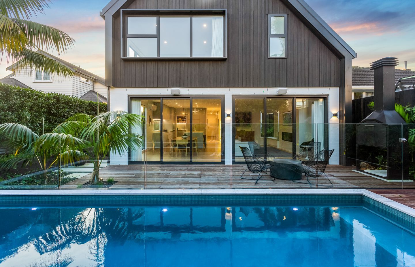 In spite of being sited at the south side of the property, the living space enjoys plenty of light and views out to the idyllic pool.