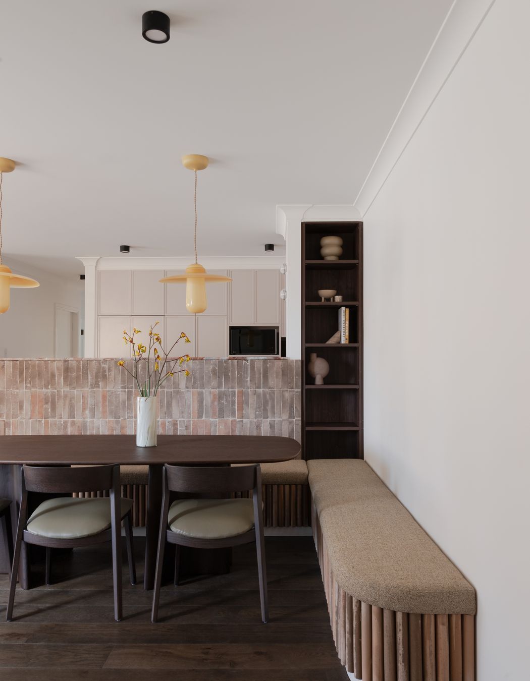 Stand-out features include honey-coloured Italian glass pendants, designed by Sjoerd Vroonand and made in the Netherlands for Space Furniture, that have been hung above the dining table.