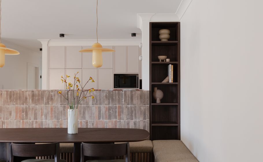 An unexpected material palette transforms this unassuming apartment into a beautifully bold design statement