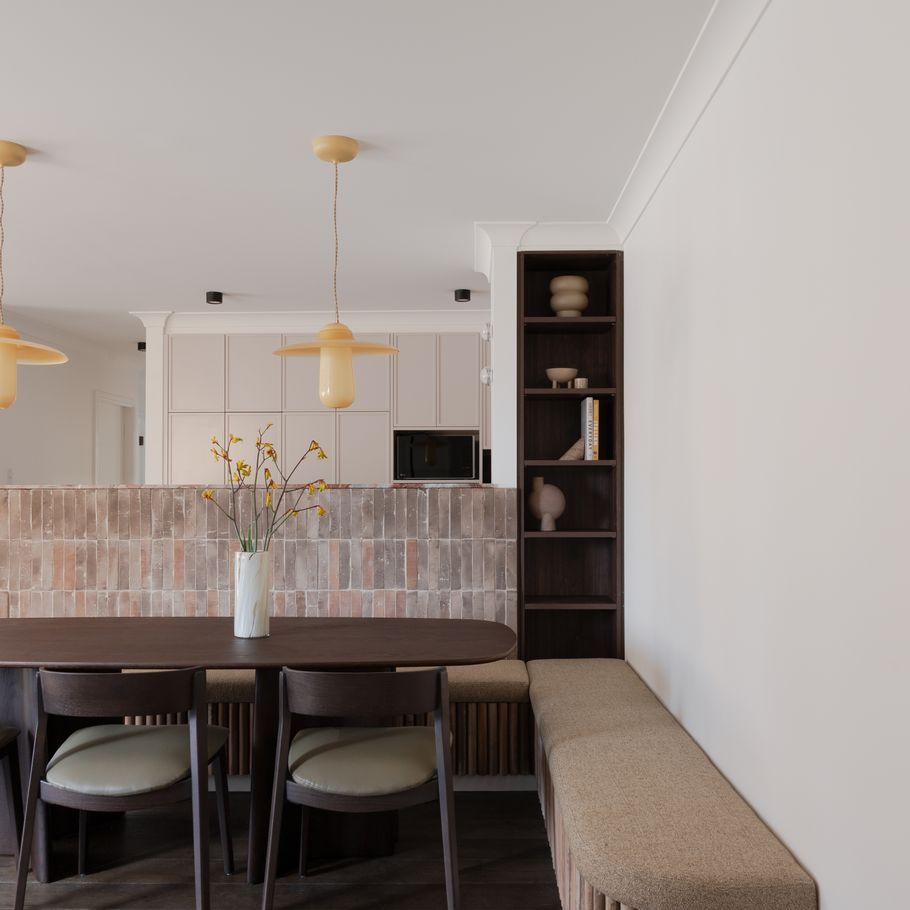 An unexpected material palette transforms this unassuming apartment into a beautifully bold design statement