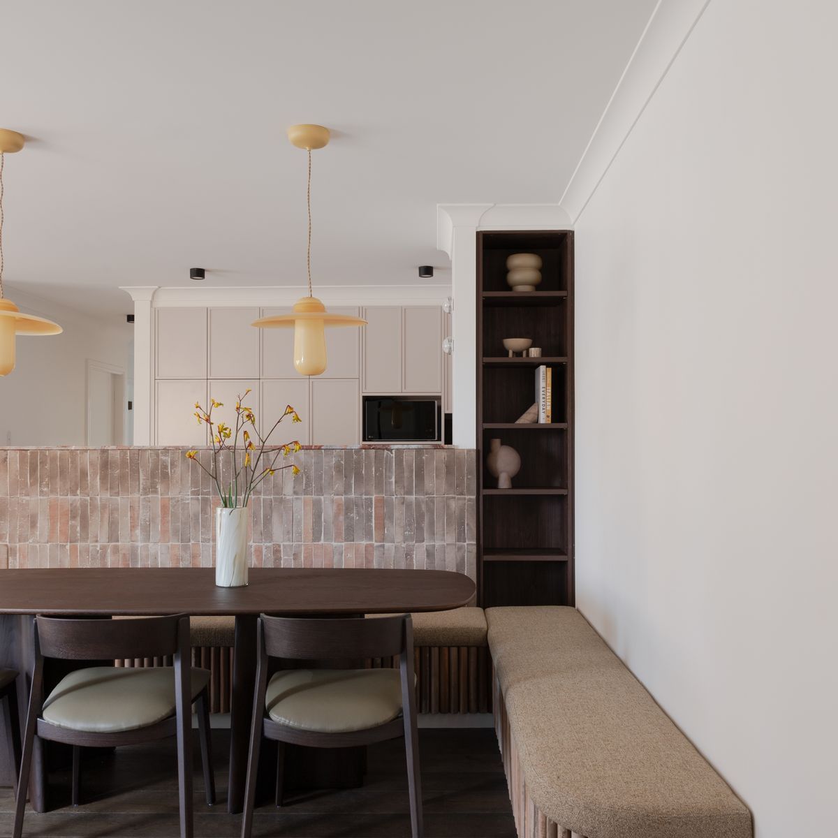 An unexpected material palette transforms this unassuming apartment into a beautifully bold design statement