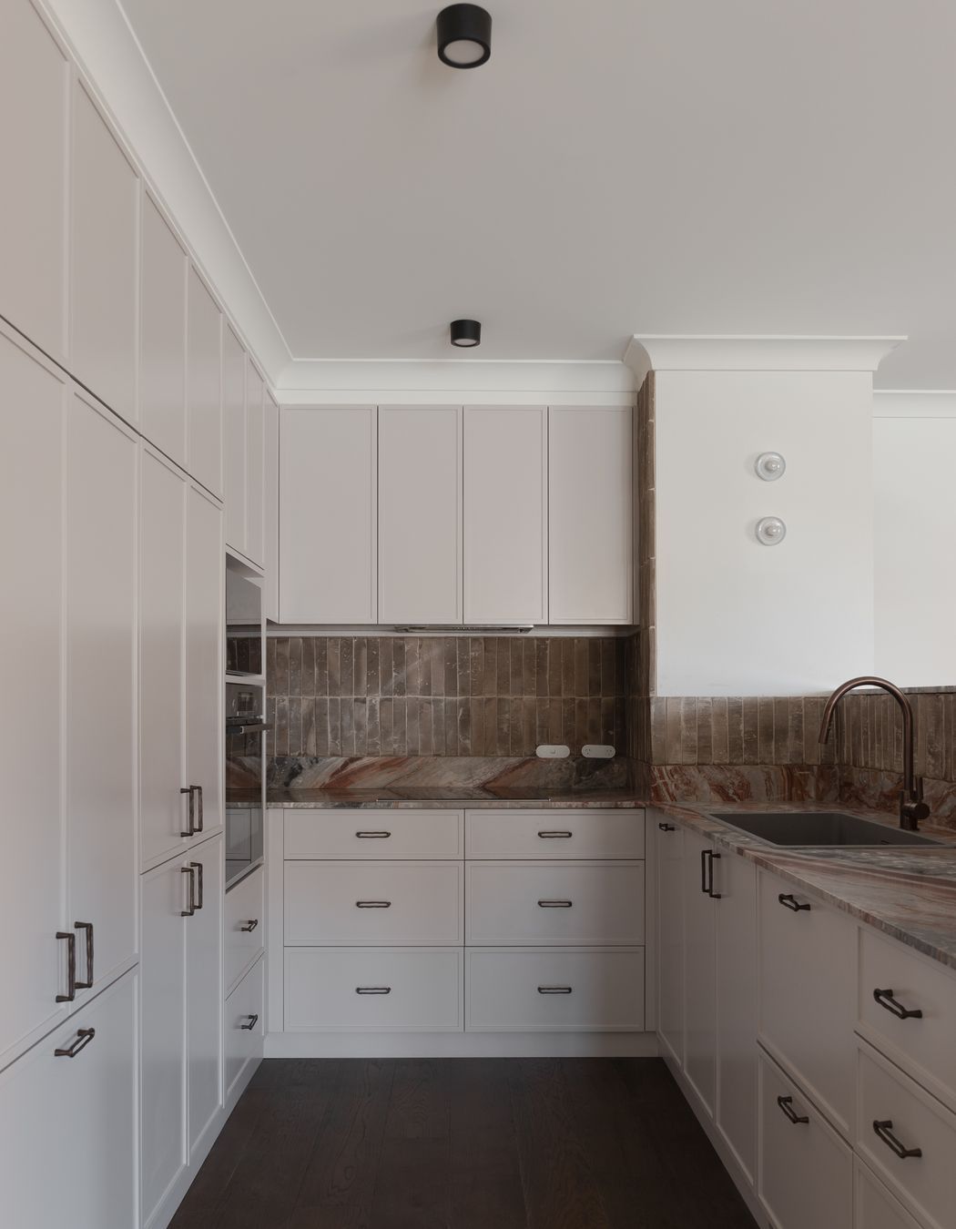 Custom handmade terracotta fluted tiles, created by Earp Brothers, drove the design for this apartment.