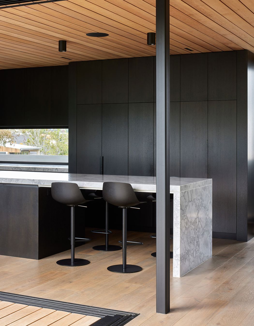 “We worked heavily around the detailing of the expressed negative cedar ceiling on plywood throughout,” says Clint.