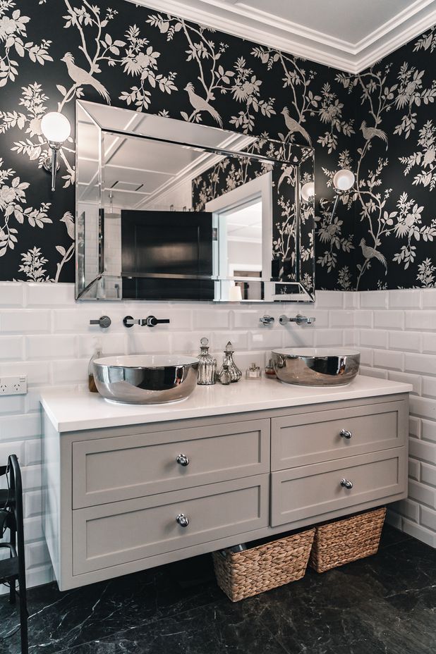 The master ensuite includes a freestanding bathtub from Franklins and separate shower; cabinets from Blanc Industries; and a classic black and white colour palette.