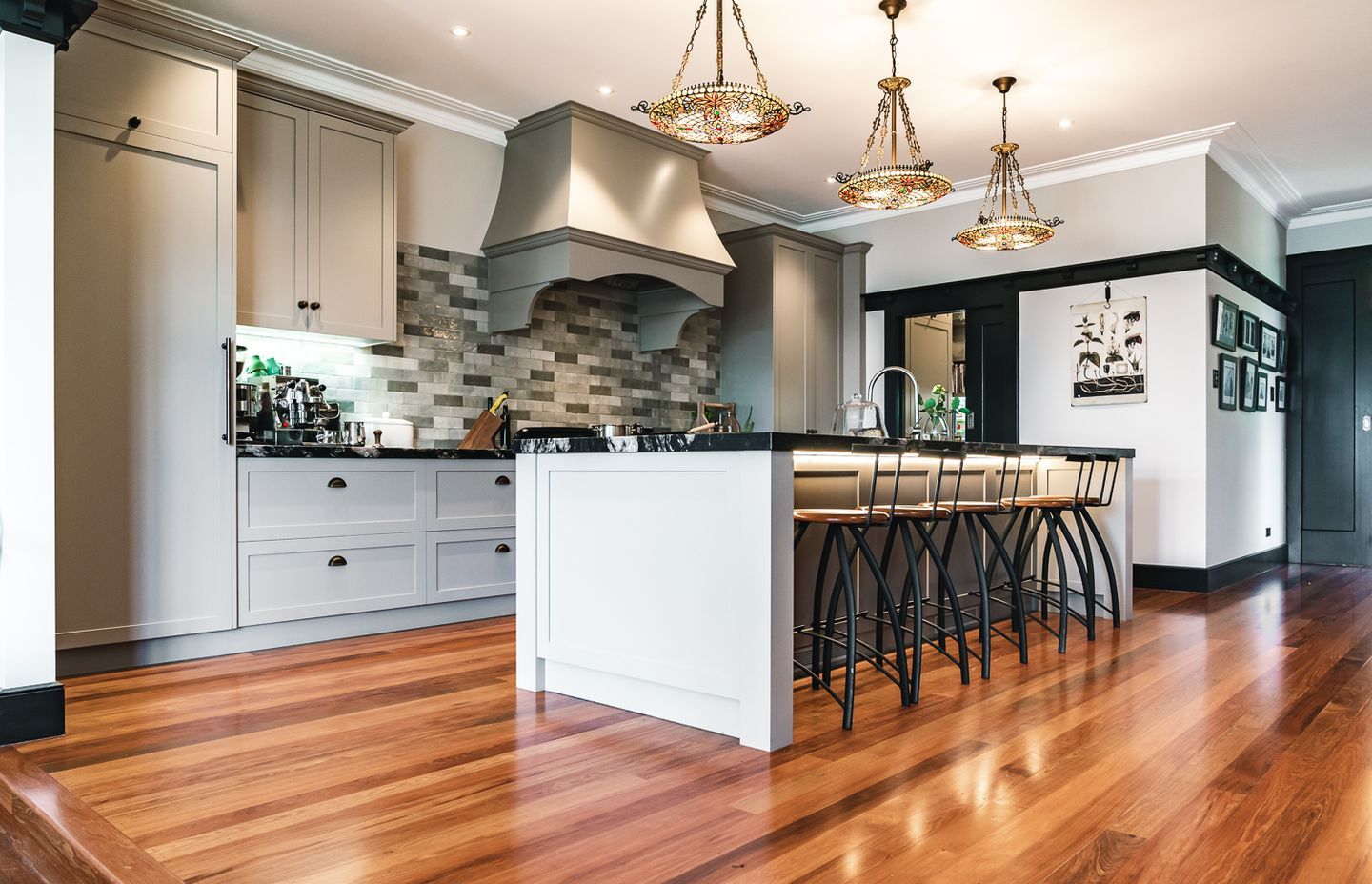 The kitchen features leathered granite benchtops from Stone Warehouse, with shaker style cabinets crafted by Neil Taylor Cabinetmaker &amp; Design.