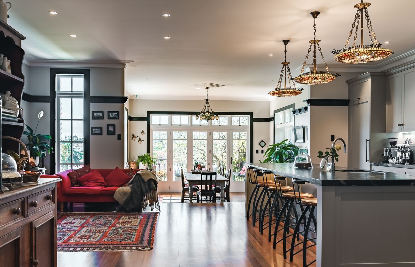 “At the front stepped down from the kitchen is the dining room, which is fully glazed to let in heaps of natural light. There’s a sitting area that is used as a coffee spot right next to the kitchen, which ties in nicely,” shares Joseph.