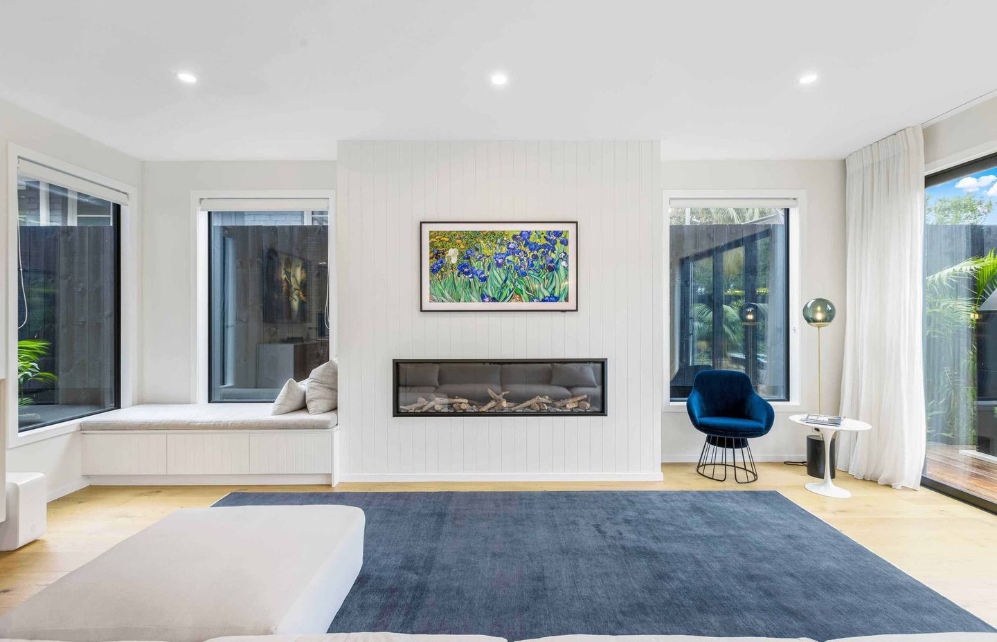 The downstairs living space enjoys light from all sides and has direct access to the outdoor living space through sliders.