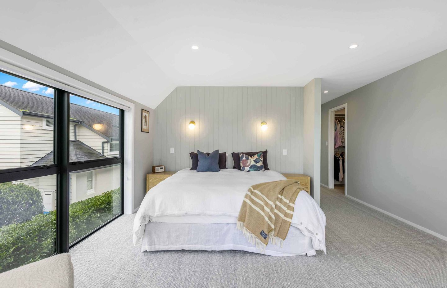 The master suite has its own private spot upstairs, overlooking the pool area.