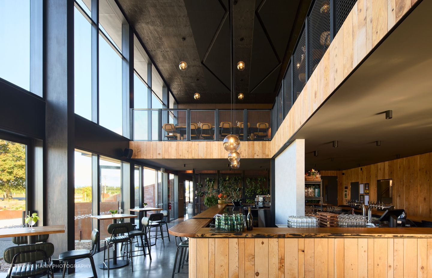 To the north, the main cellar door and dining area are lit by all-day sunlight.