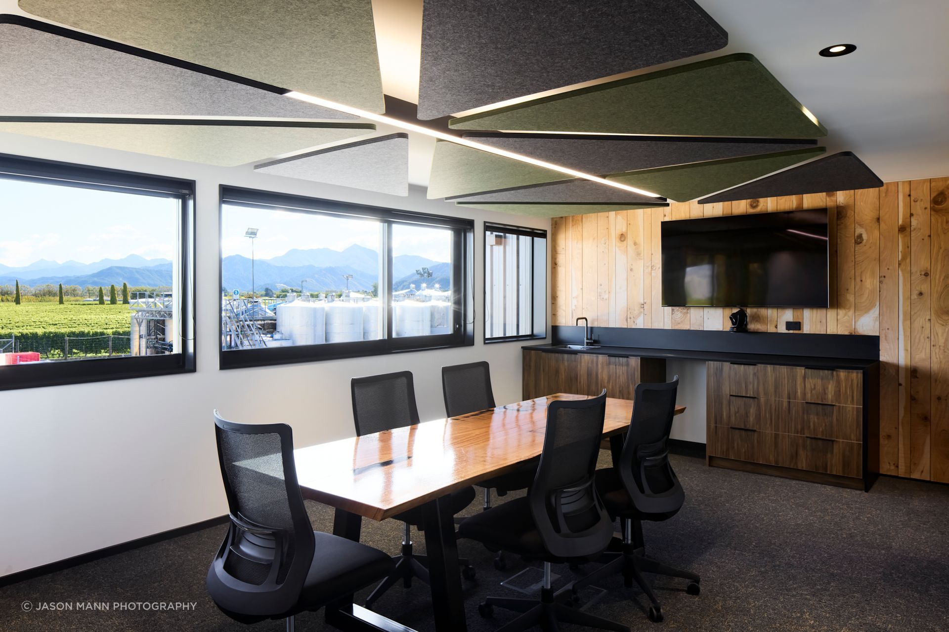 Upstairs, an open-plan office space includes a boardroom.