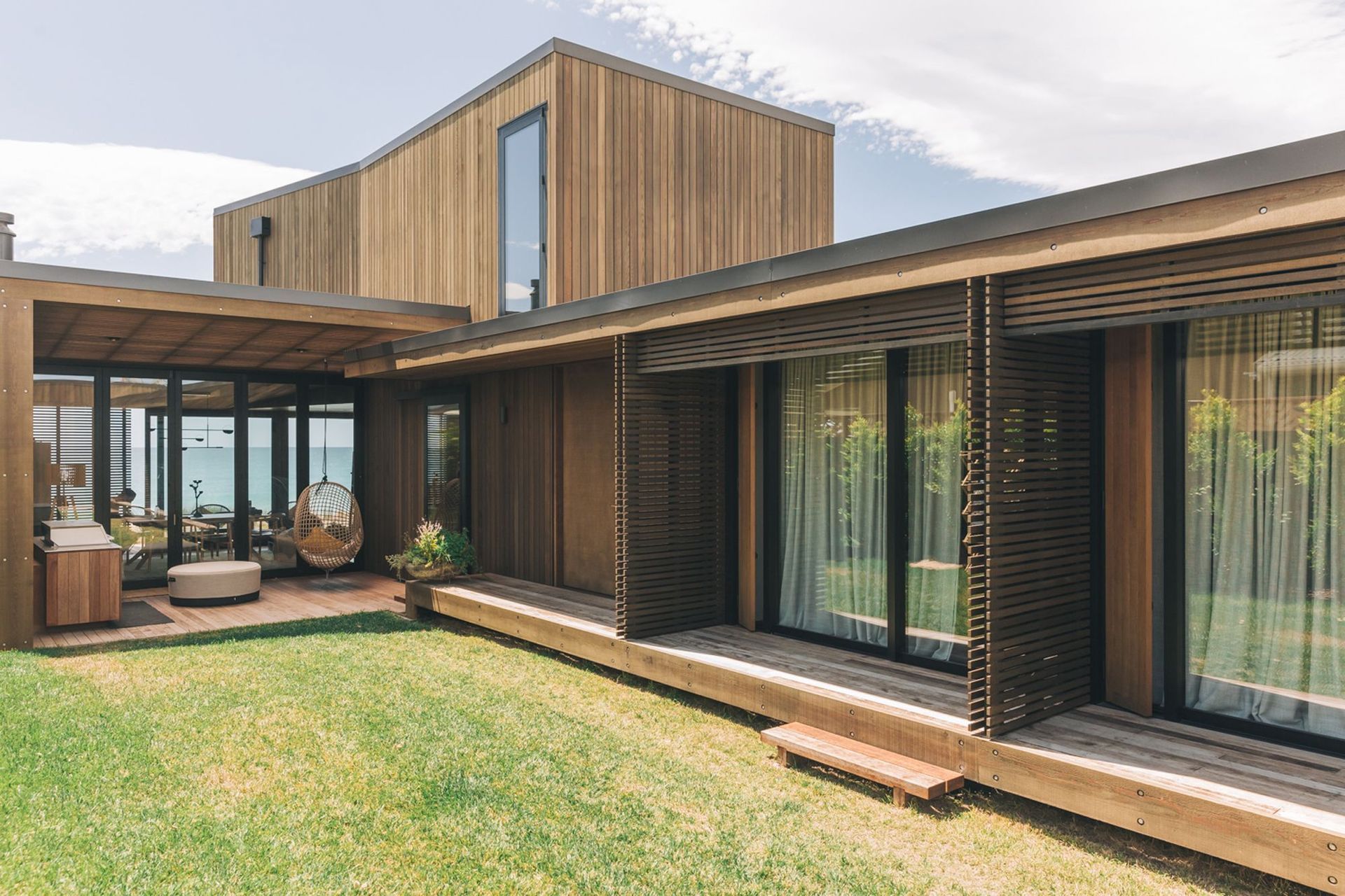 The central courtyard links each of the bedrooms on the ground floor with the entertaining area and beachfront beyond.
