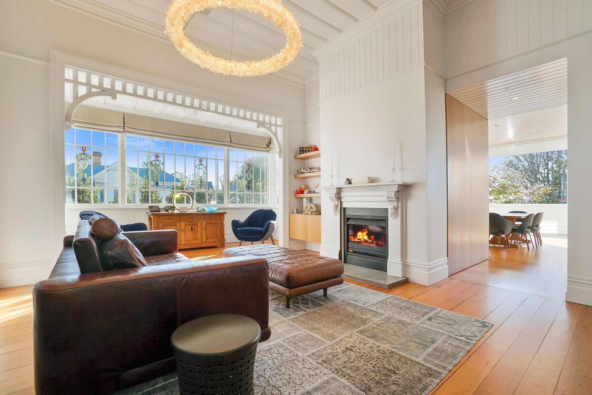 A living room that exudes warmth, thanks in no small part to the statement fireplace.