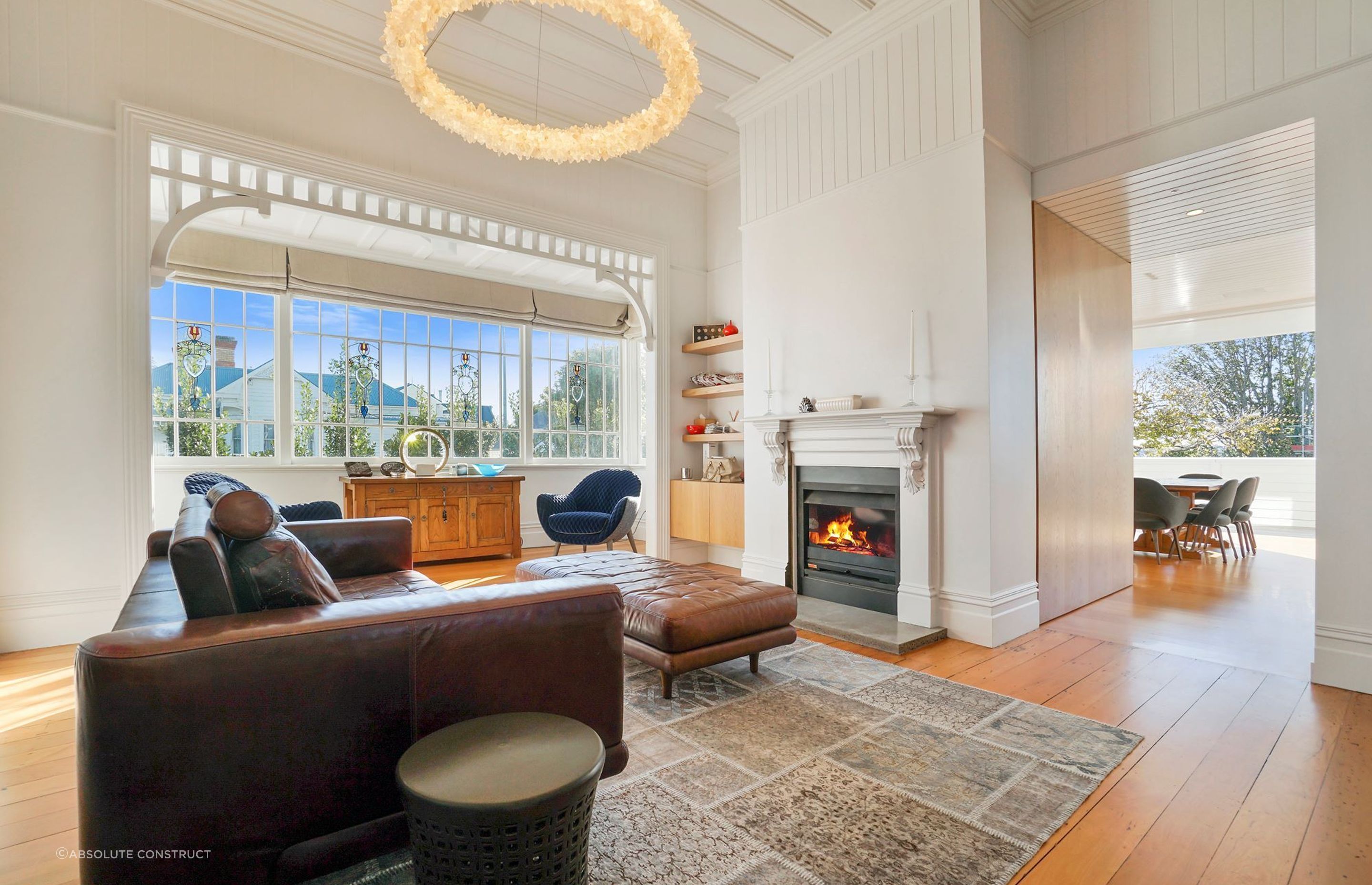 A living room that exudes warmth, thanks in no small part to the statement fireplace.