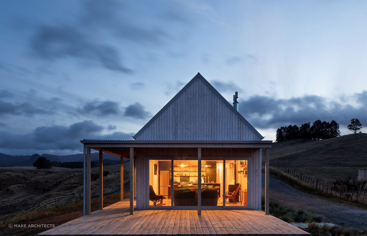 The warm glow beckons from within as day turns to dusk. — Photography: David Straight.