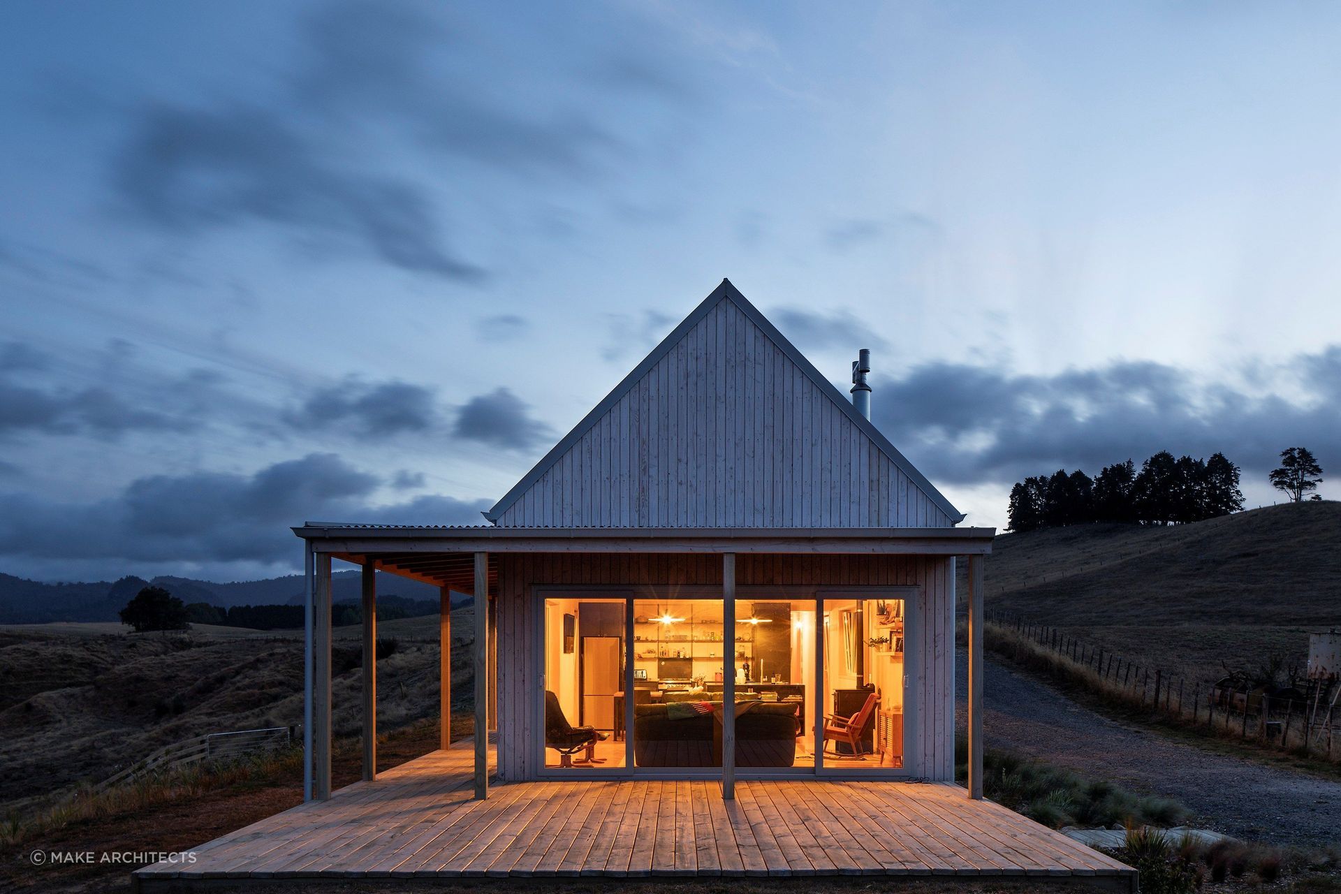 The warm glow beckons from within as day turns to dusk. — Photography: David Straight.