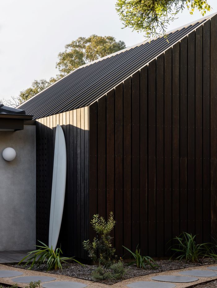 Clad in spotted gum the extension blends with the rendered exterior.