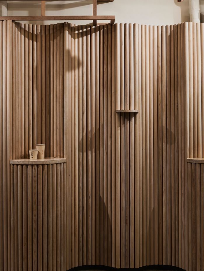 The sculptural form of the timber allows the existing services to be hidden.