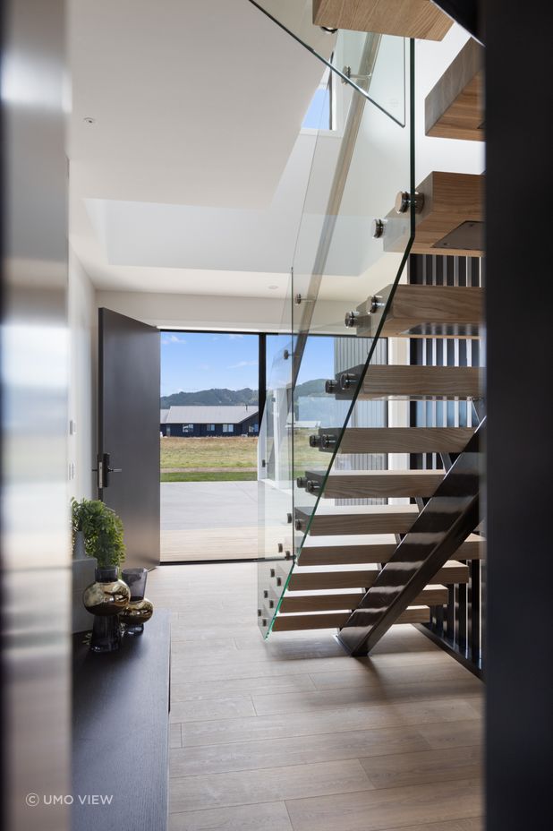 “We wanted the first impression of the home to be memorable, and the staircase, especially when lit up at night, achieves just that,” says Quigley.