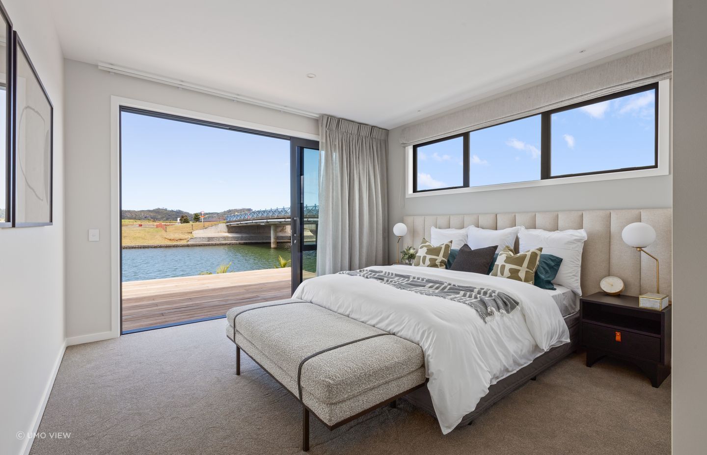 A retreat for relaxation, the master bedroom also enjoys the stunning water view.