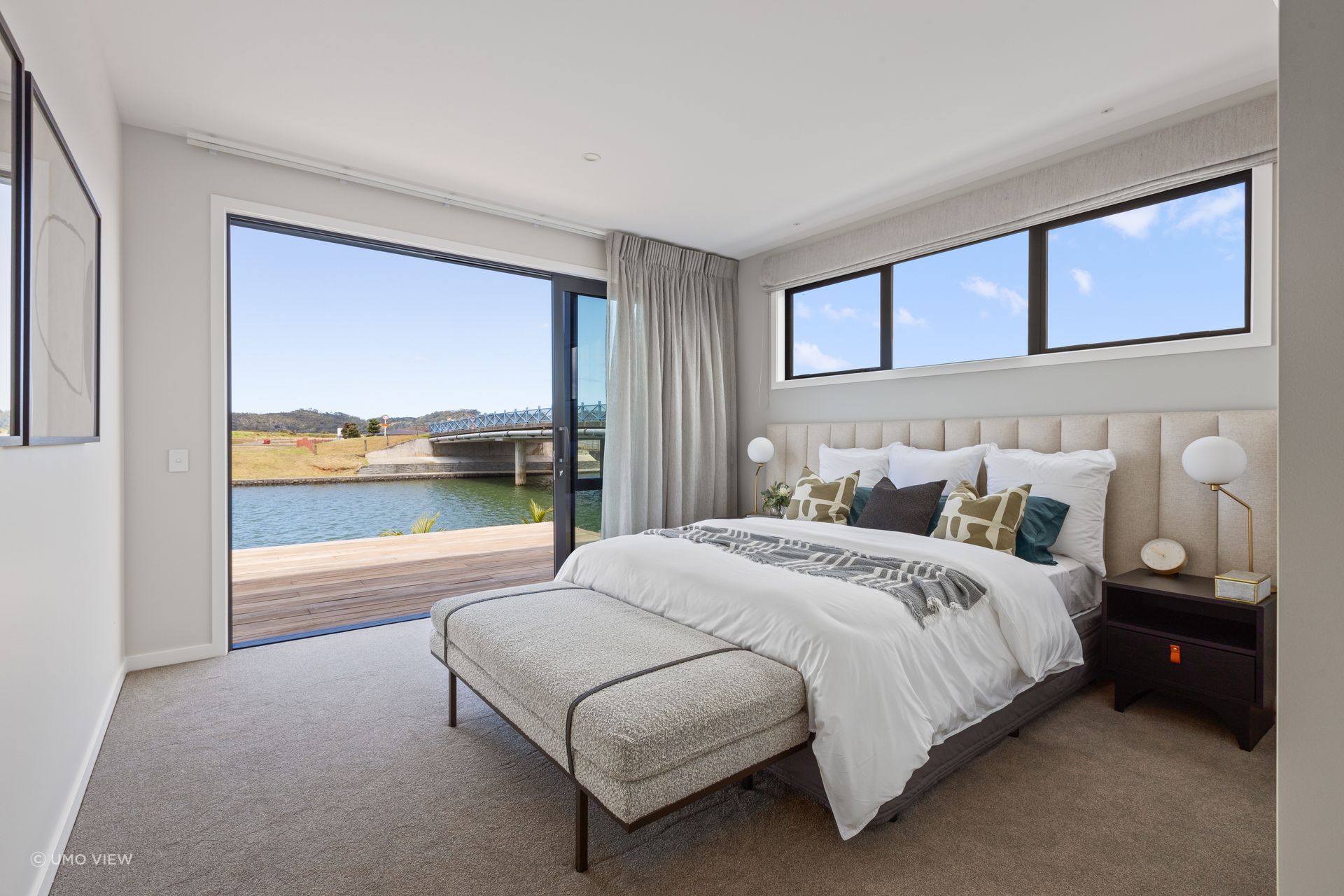 A retreat for relaxation, the master bedroom also enjoys the stunning water view.