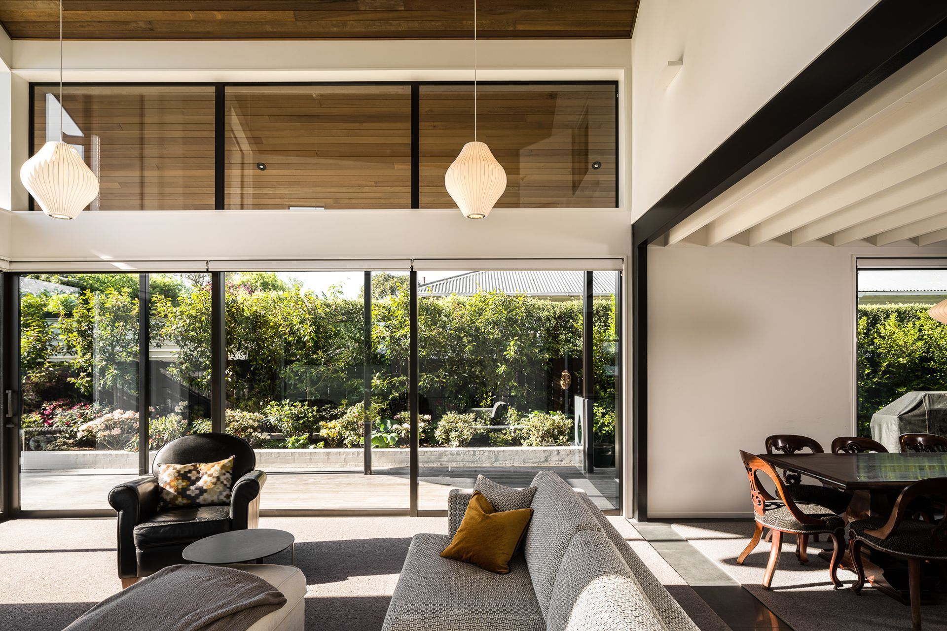 Large doors and windows look out to the back area of the house, allowing for ample sun and privacy.