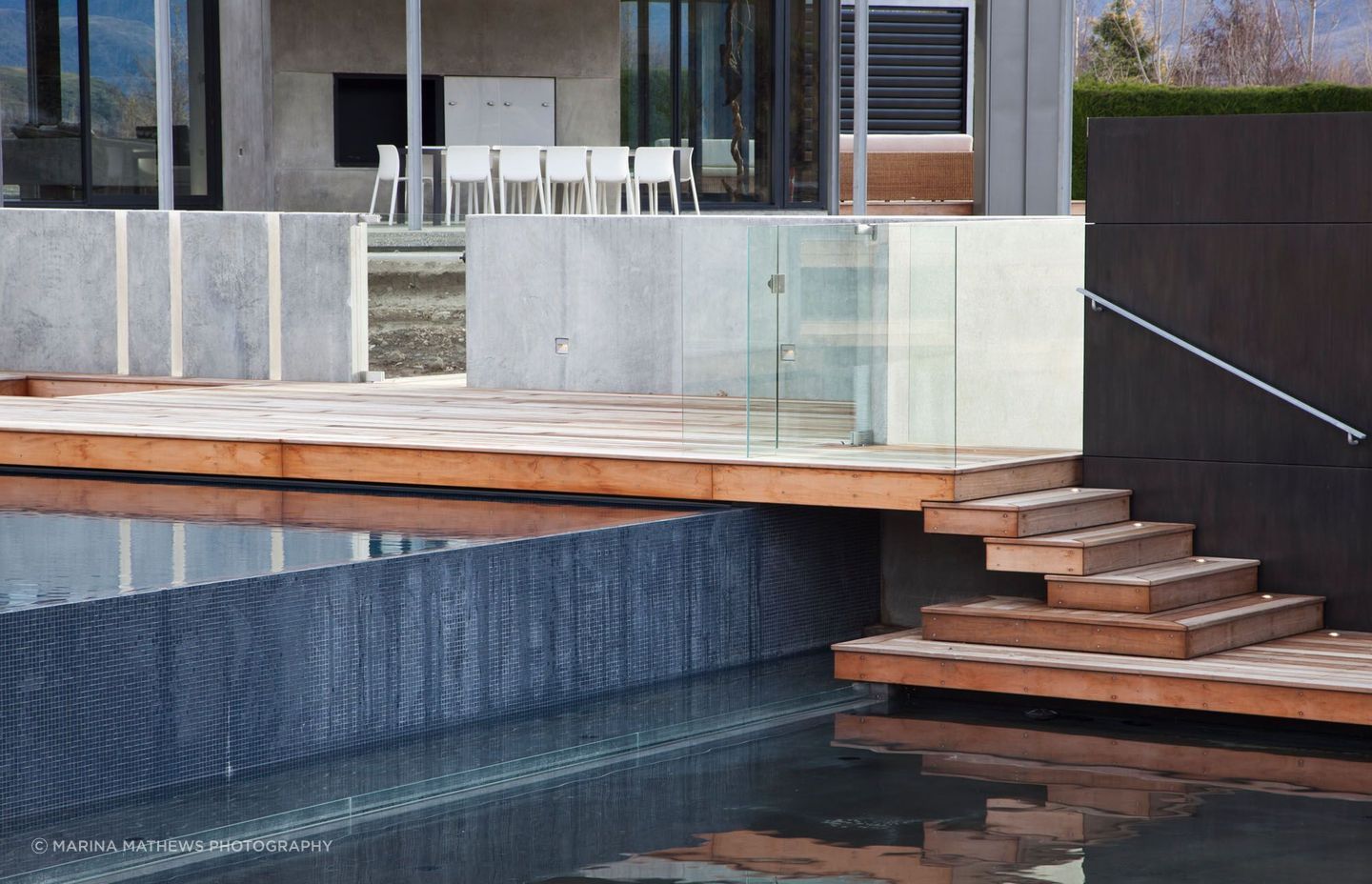 The pool bowl, spillover, and partition walls were formed using shotcrete.