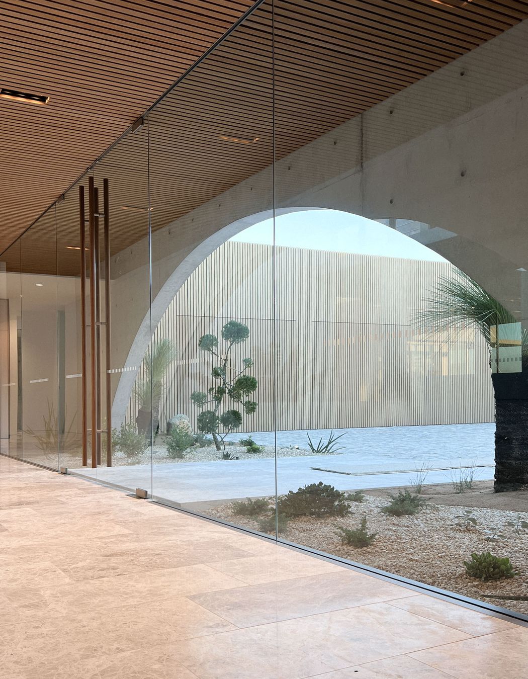 From inside the home. the floor to ceiling entry glazing suite enables light to pour into the home.