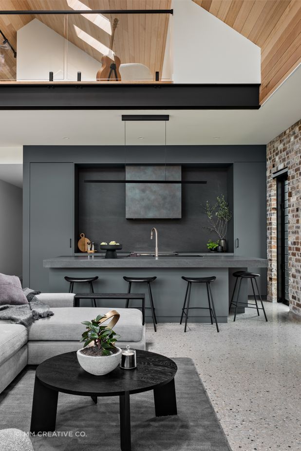 The teenager's retreat on the mezzanine floor is visually linked to the main living space.