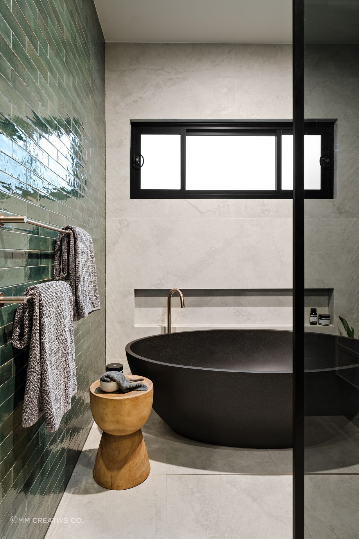 The beautiful black stone bath is a feature of the family bathroom.