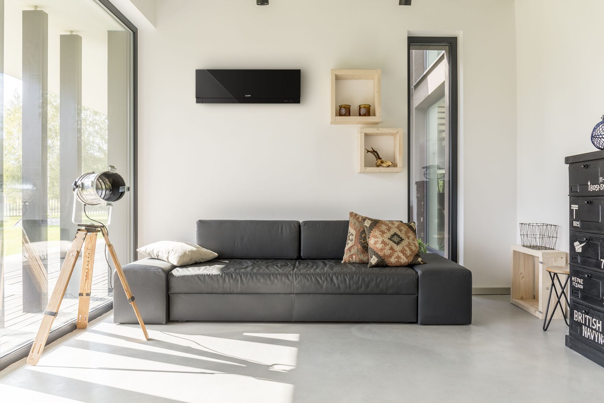 The Designer Series or Black Diamond Series High Wall Heat Pump in black can tie into other design elements such as black window joinery.