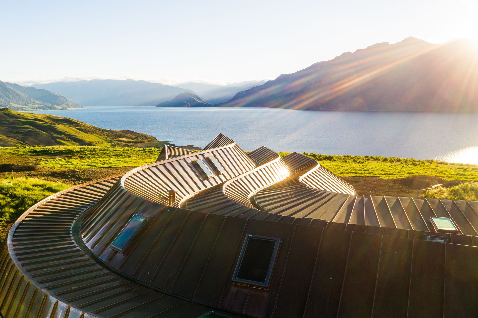 The roof's sculptural form ripples like icing on a cake.