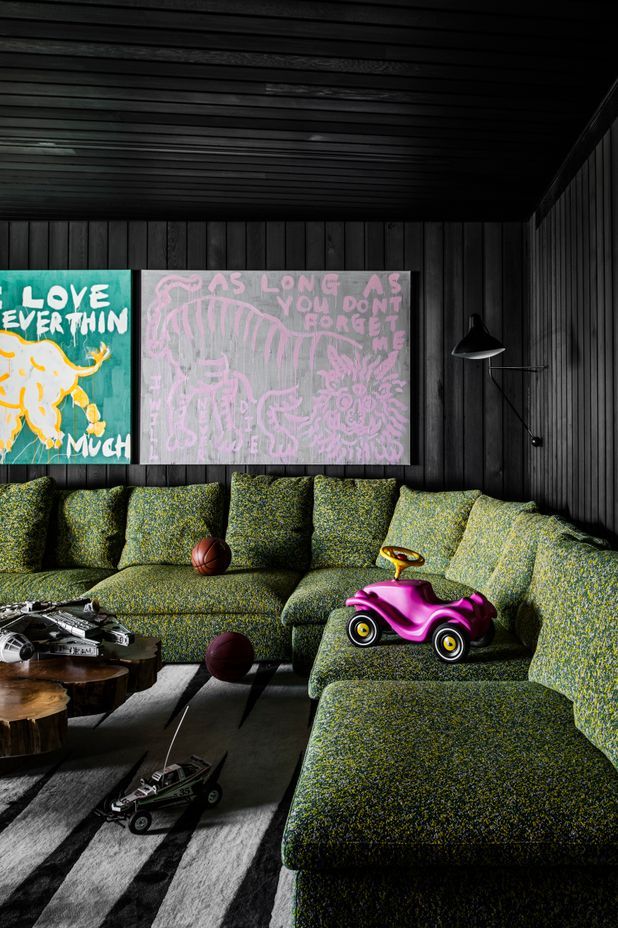 A playroom on the bottom floor features stained timber panelling and is a cosy place to retreat to.