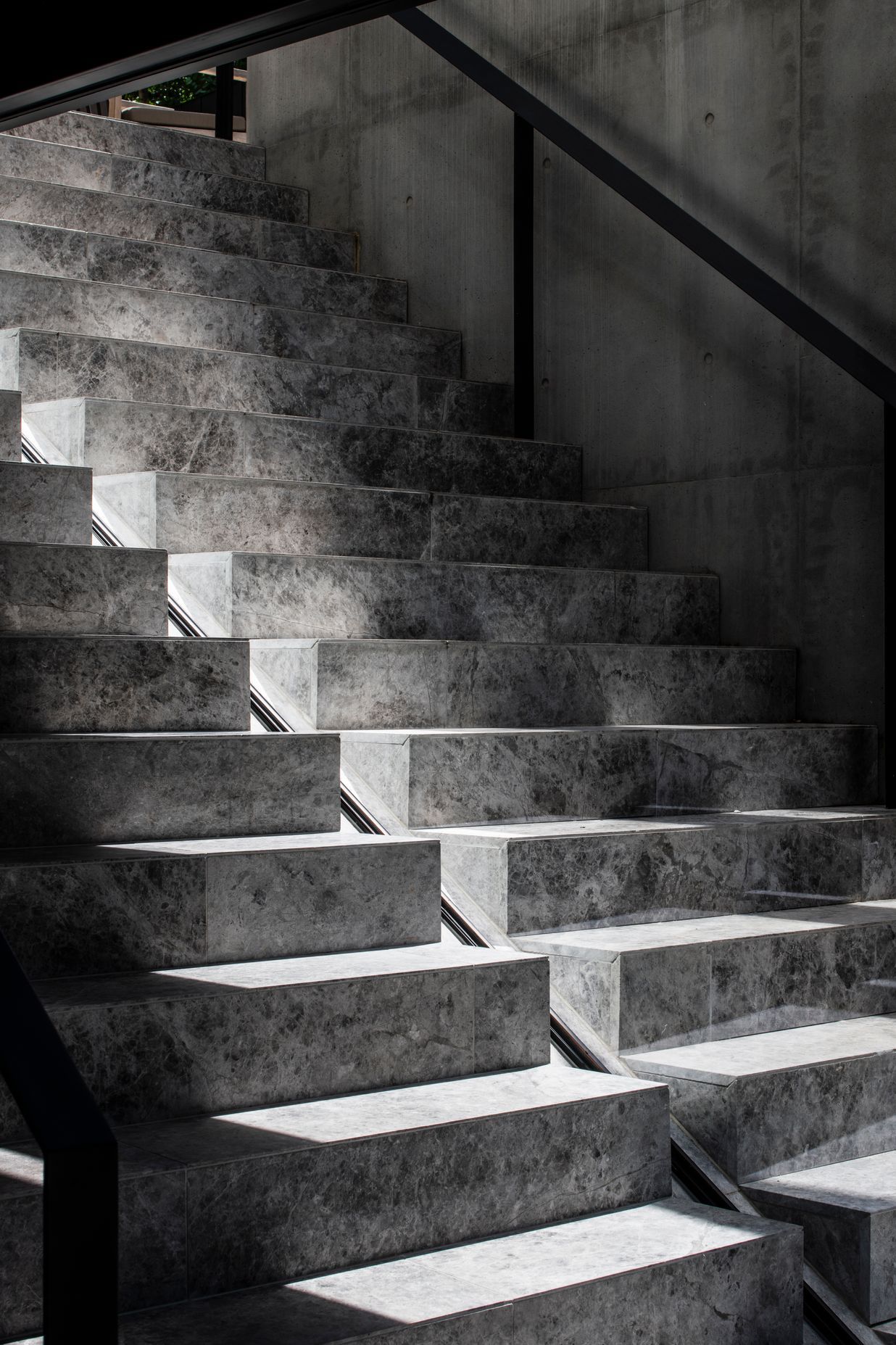 The precast stairs leading to the pool showcase the incredible workmanship of the builders and concreters.