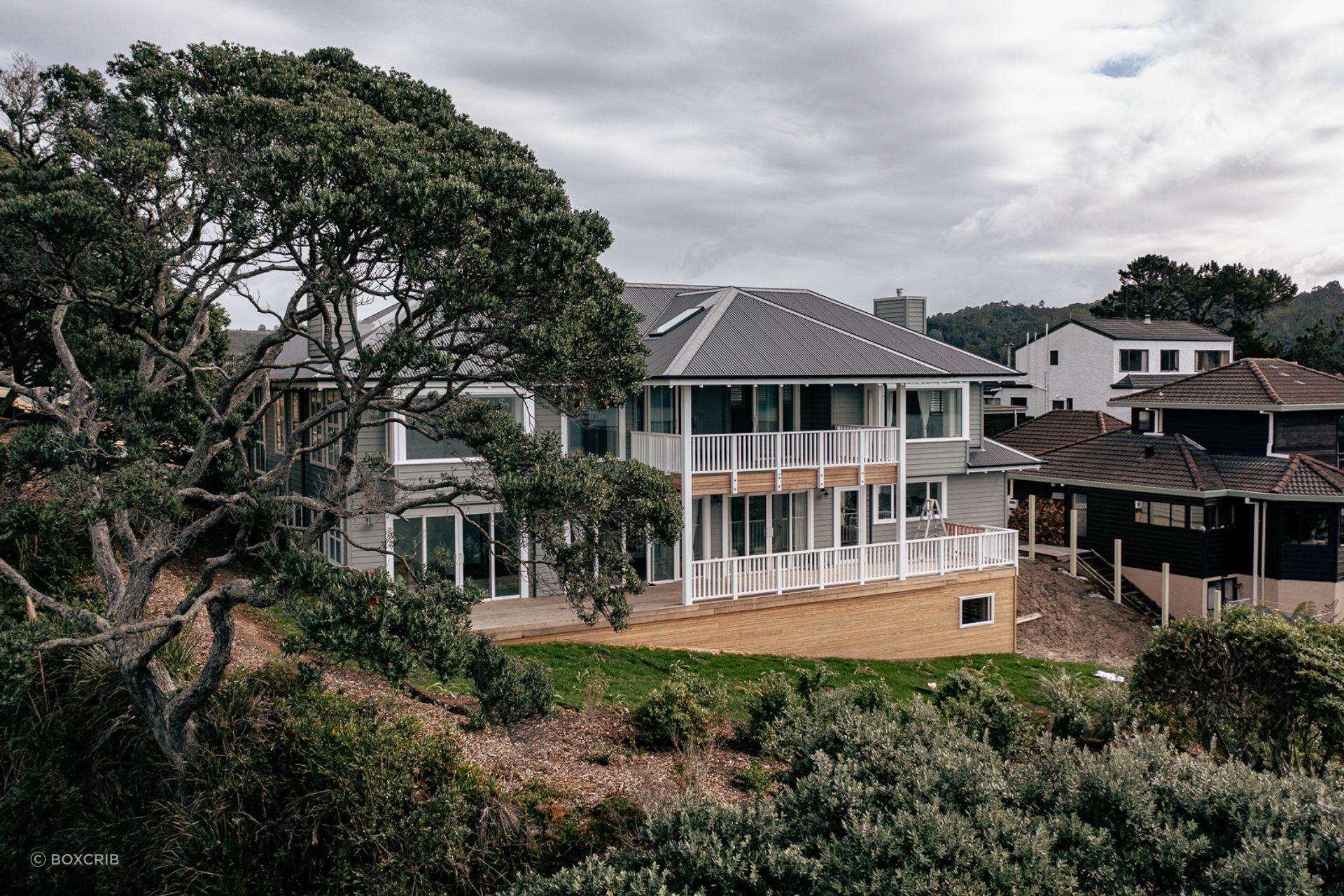 The Cape Cod-style home features a classic symmetry and character detailing.