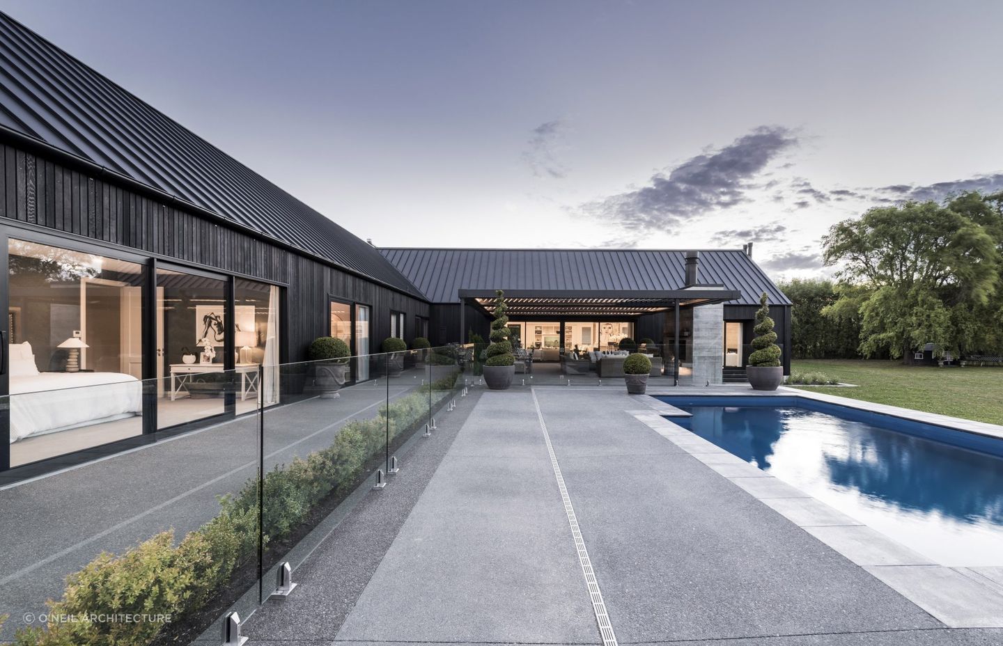 A reflective pond can be enjoyed from nearly every space in the home.