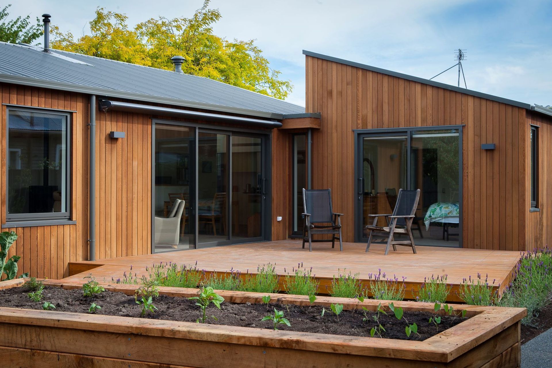 A lovely little deck and garden space awaits for comfortable outdoor living.